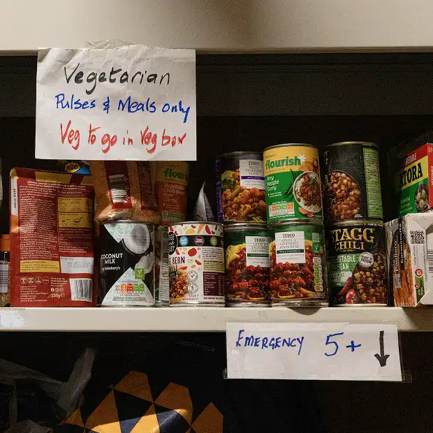 Shelf of vegetarian canned meals at Longridge Food Bank.