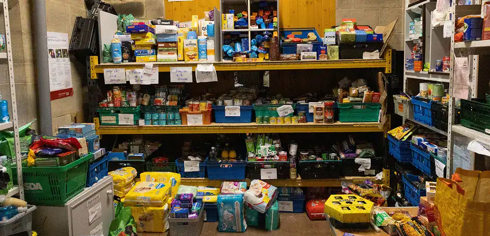 Shelves stocked with food donations at Longridge Food Bank.